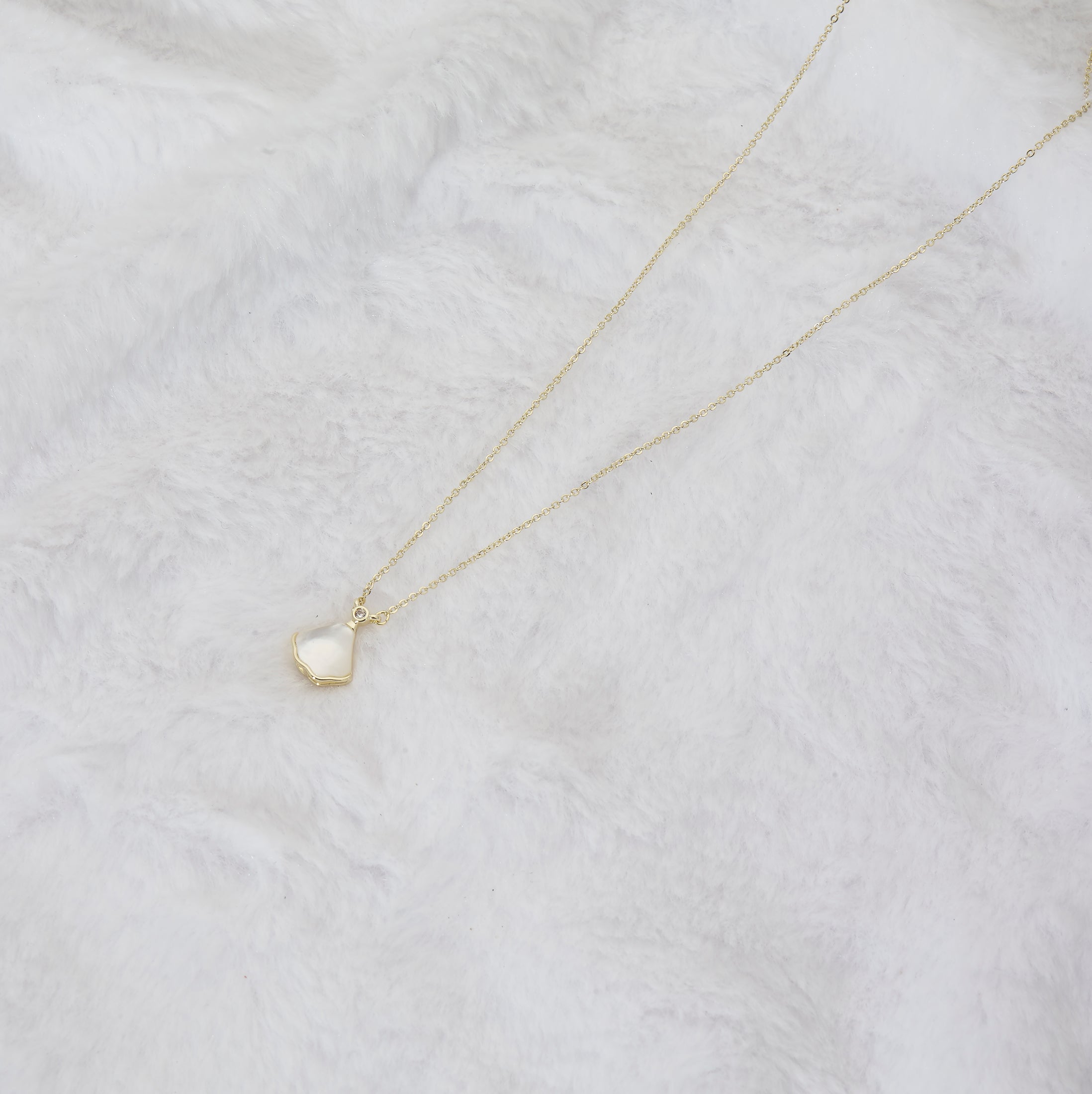 White stone pendant